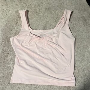 size medium pink tank top with rouched tail and slits on side